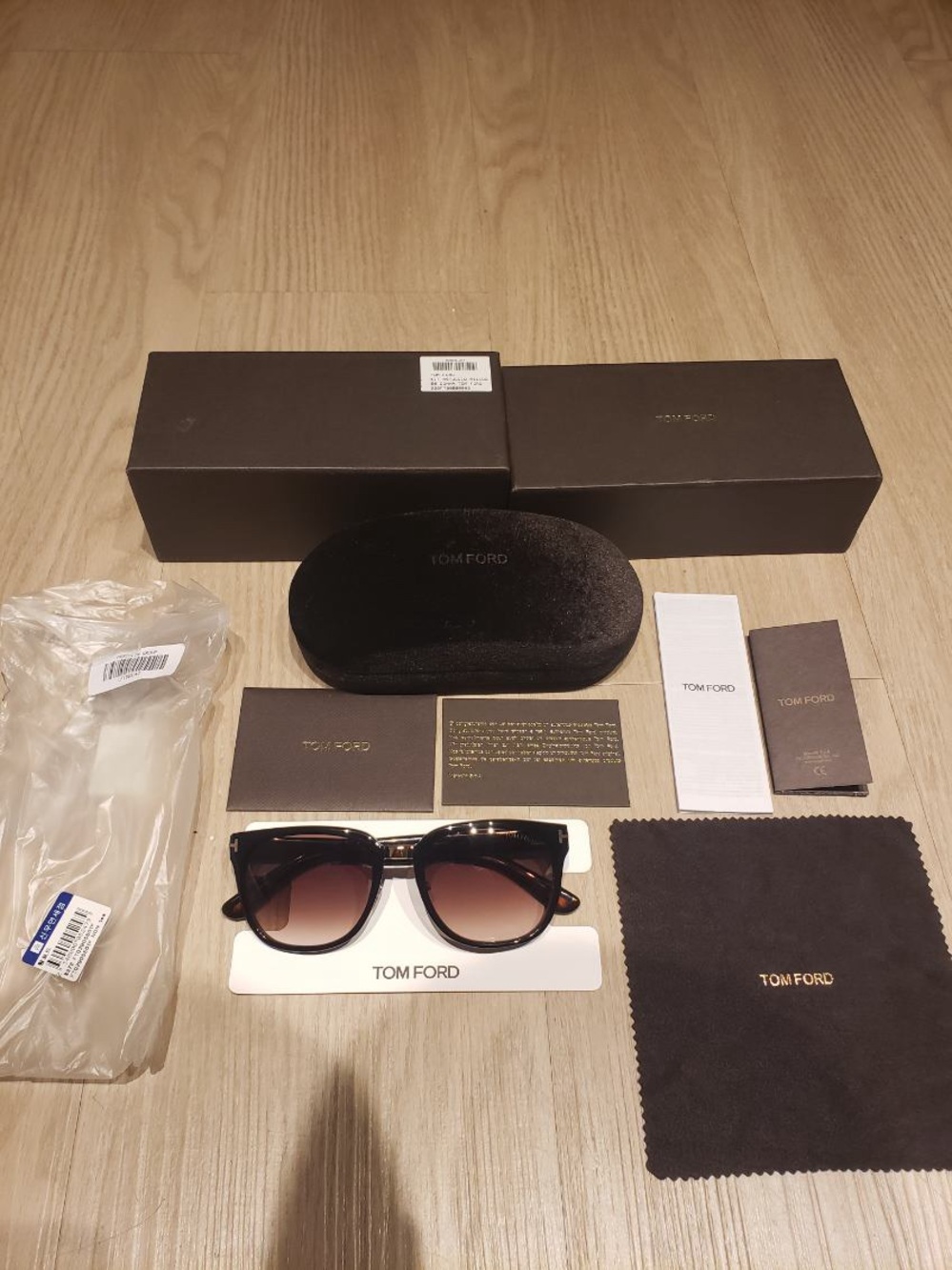 Tom Ford Unisex  Black Frame Sunglasses with Brown Gradient Lenses.